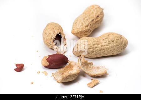 Dried peanut crushed in the air close-up on white background. Stock Photo