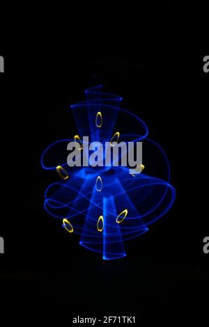 Abstract curved blue shape with a bright saber. Pattern for wallpaper. Made with lightpainting technique. Stock Photo