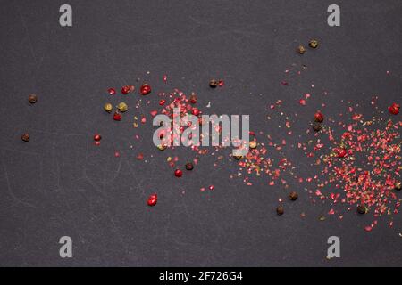 Colored Peppers Mix on the darck background. Stock Photo