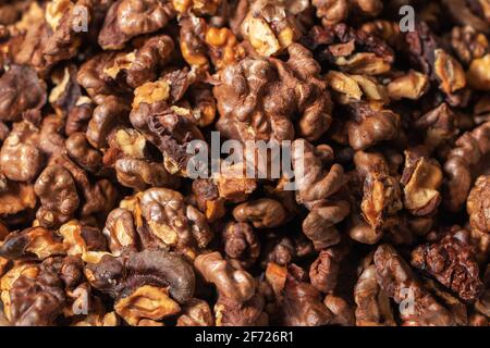 Dry walnut. Closeup of big shelled walnuts pile. Nuts background. Stock Photo