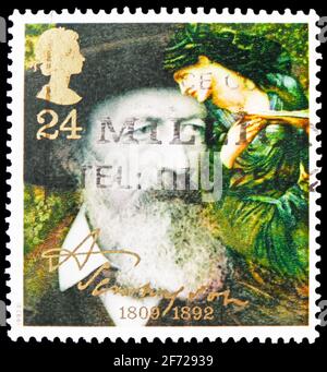 MOSCOW, RUSSIA - FEBRUARY 28, 2021: Postage stamp printed in United Kingdom shows Tennyson in 1888 and 'The Beguiling of Merlin', Death Centenary of L Stock Photo