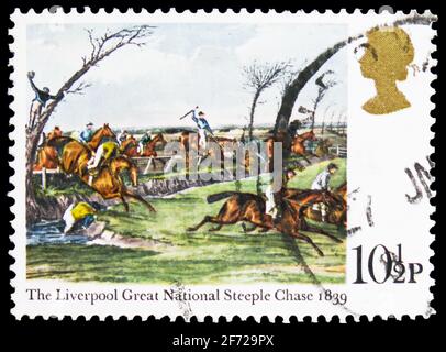 MOSCOW, RUSSIA - FEBRUARY 28, 2021: Postage stamp printed in United Kingdom shows The Liverpool Great National Steeple Chase, Horseracing Paintings se Stock Photo