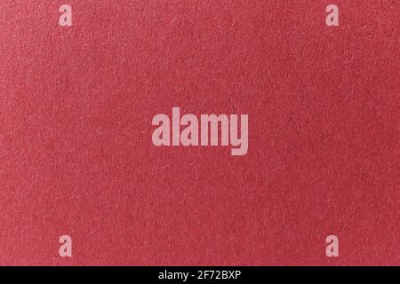Burgundy colored paper texture background, paper surface close-up photo Stock Photo