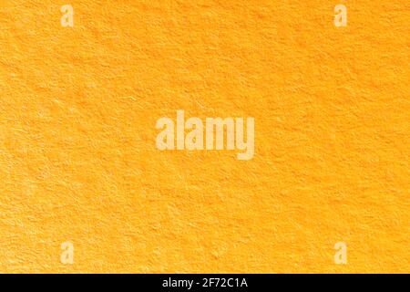 High detailed orange paper texture background, grainy paper srface close up Stock Photo