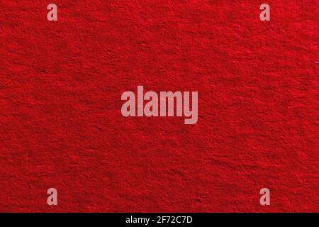 Dark red or burgundy paper surface close up, texture background with grainy paper Stock Photo