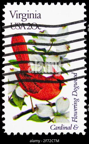 MOSCOW, RUSSIA - JANUARY 19, 2021: Postage stamp printed in United States shows Virginia Northern Cardinal and Flowering Dogwood, State Birds and Flow Stock Photo