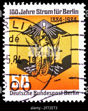MOSCOW, RUSSIA - DECEMBER 22, 2020: Postage stamp printed in Germany, Berlin, shows Allegory of Karl Ludwig Sütterlin, 100 years power for Berlin seri Stock Photo