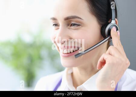 Portrait of smiling woman with headphones and microphone Stock Photo