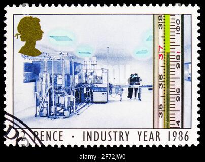 MOSCOW, RUSSIA - DECEMBER 22, 2020: Postage stamp printed in United Kingdom shows Thermometer and Pharmaceutical Laboratory (Health), Industry Year se Stock Photo