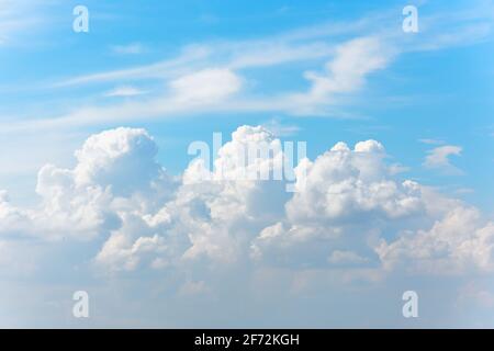 Huge cumulus cirrus clouds in the summer blue sky Stock Photo