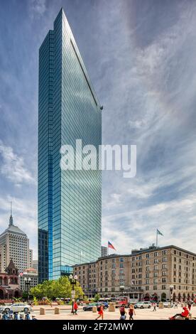 200 Clarendon Street, aka John Hancock Tower, reflects the sky and everything around it in the famous blue glass panels. Stock Photo