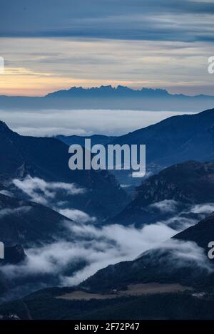 Montserrat mountains and Llobregat valley  among morning fogs, seen from the Devesa viewpoint, in Coll de Pal, Berguedà (Barcelona province, Cataluña) Stock Photo