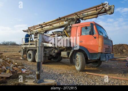 LENINGRAD OBLAST, RUSSIA - MARCH 28, 2021: Concrete pump based on Kamaz car on construction site Stock Photo