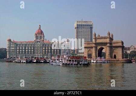 A view of the magnificent Gateway to India beside the Taj hotel and Tower hotel viewed from the harbour at Mumbai (formerly Bombay).