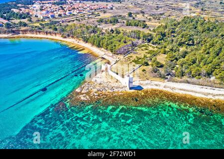 Island of Vir waterfront and fortress ruins aerial view, Dalmatia region of Croatia Stock Photo