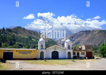 Village church, in the back the mountains Nevado Huandoy and Nevado Huascaran, Huarascucho, Cordillera Blanca, province Yungay, Peru Stock Photo