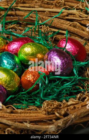Chocolate eggs in basket, basket, chocolate eggs, easter eggs, sweets, chocolate, chocolate easter eggs Stock Photo