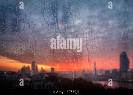 Beautiful landscape conceptual view of London City through glass window with raindrops running down the glass Stock Photo