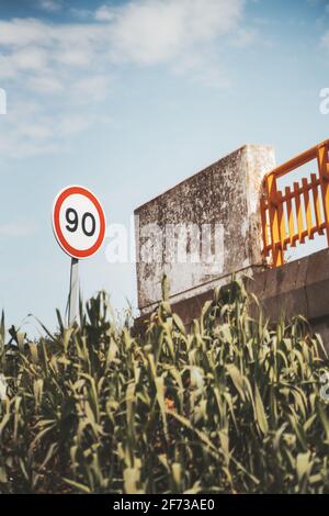 A speed limit sign with number 90 added on it Stock Photo - Alamy