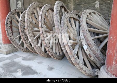 old cart wheels piled together-DafoSi Great Buddha Temple compound. Zhangye-Gansu-China-1275