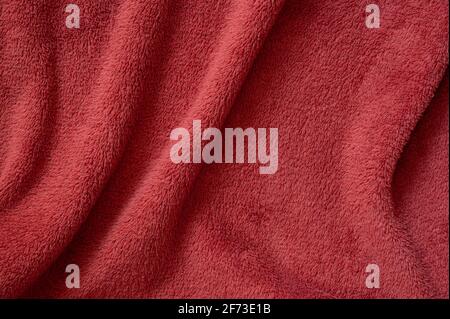 Plush wavy red texture. Macro photo. Fabric background Stock Photo