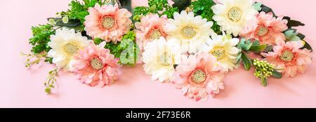 Mother's day or birthday greeting card concept. Festive flower arrangement on a pastel pink background. Banner. Stock Photo