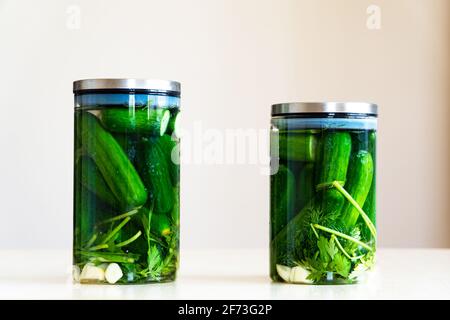 glass jar filled with pickled cucumbers Stock Photo