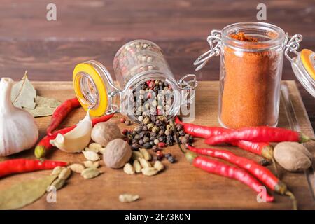 Composition with different spices on wooden background, closeup Stock Photo