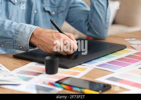 Male designer working in office Stock Photo