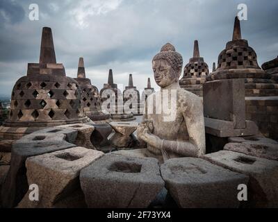 Ancient ruins of Borobudur, a 9th-century Mahayana Buddhist temple in Magelang Regency near Yogyakarta in Central Java, Indonesia. Stock Photo