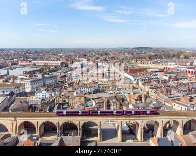 Mansfield Town England Cityscape aerial view of town with big long stone railway viaduct arches train passing over bridge with town old market place Stock Photo