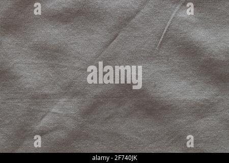 Top view, gray crumpled linen fabric background. Close-up of tea towel, napkin, tablecloth or clothing. Concept of simplicity, environmental friendlin Stock Photo