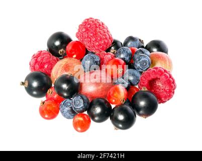 Mixed berries isolated on a white background. Fruit mix. A pile of berry fruits, blueberries, raspberries, currant black and red. Stock Photo