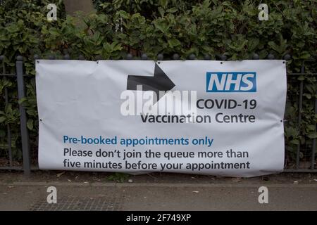 Sign showing the way to the NHS Covid-19 vaccination centre, Chiswick, west London UK Stock Photo