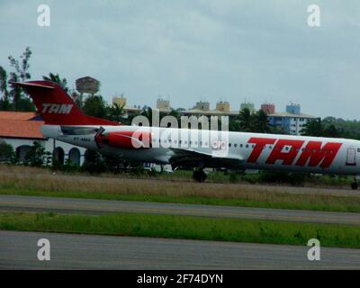 salvador, bahia / brazil - august 2, 2005: model aircraft Fokker 100 Tam Linhas Aereas is seen in landing procedure on the runway of Salvador airport. Stock Photo