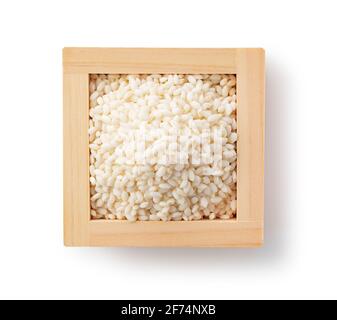 Glutinous rice in a wooden box on a white background. View from above Stock Photo