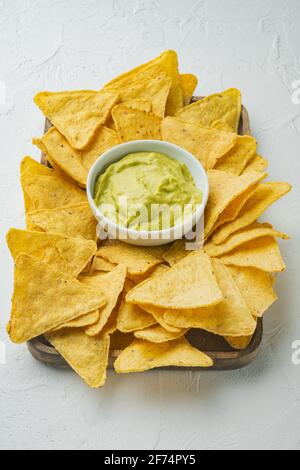 Nachos corn chips with traditional dip sauce set, on white background Stock Photo