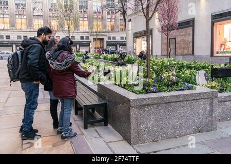 New York, United States. 03rd Apr, 2021. Easter garden with lilies, tulips, daffodils, daisies, bluebells flowers opened at Rockefeller Center in New Yokr, on April 3, 2021. Metallic Easter eggs and Easter bunnies installed throughout the plant beds. Metallic eggs produce beautiful reflections of flowers and surrounding area. (Photo by Lev Radin/Pacific Press) Credit: Pacific Press Media Production Corp./Ģ����ý Live News Stock Photo