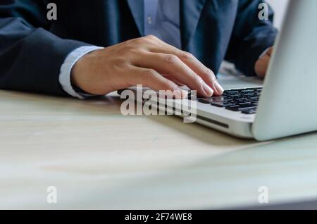business man typing on keyboard computer laptop. Stock Photo