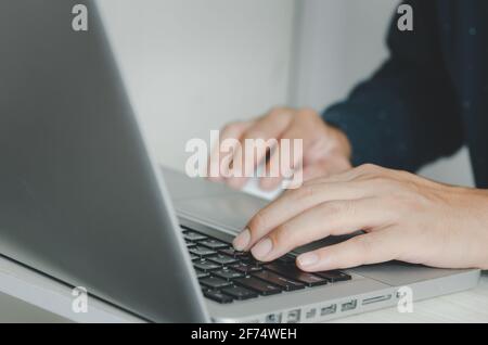 business man typing on keyboard computer laptop. Stock Photo