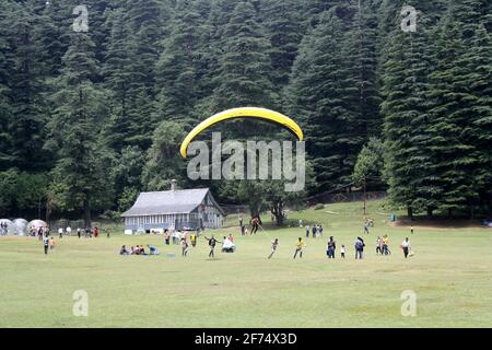 Tourists frolicking in the forest of Khajjiar in the state of Himachal Pradesh in India Stock Photo