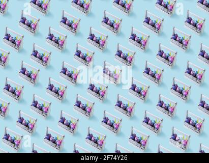 Wooden basket with many colorful painted eggs in bright shiny gliter. Seamless pattern. Easter concept Stock Photo