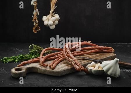 Long thin homemade beef sausages with garlic Stock Photo