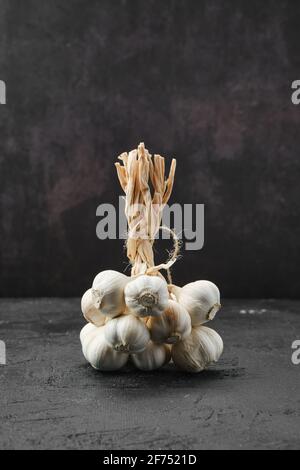 Bunch of garlic on dark background Stock Photo