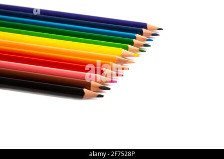 Colored pencils lie in a row, isolated on white background Stock Photo