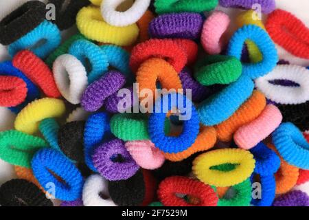 A bunch of bright colorful hair elastics. Stock Photo