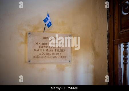 Ars-en-Ré, France - February 24, 2020: Memorial plaque of settlers leaving to Quebec. Taken inside a church of the Isle of Rhé. Stock Photo