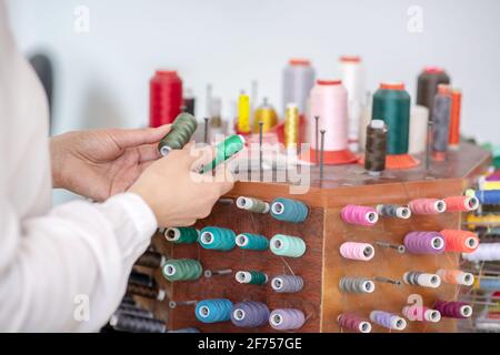 Female hands holding skeins of cotton thread Stock Photo