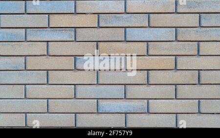 Beige-brown grunge brick wall texture or old surface pattern for background and backdrop, cream tone design element and building material in urban Stock Photo