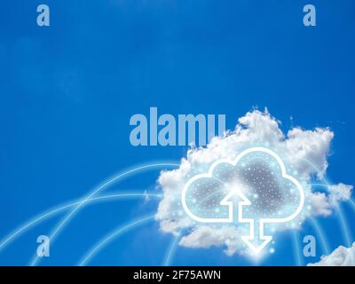 Cloud computing technology concept. Cloud digital storage icon with up and down arrows on blue sky background with copy space. Data network online ser Stock Photo